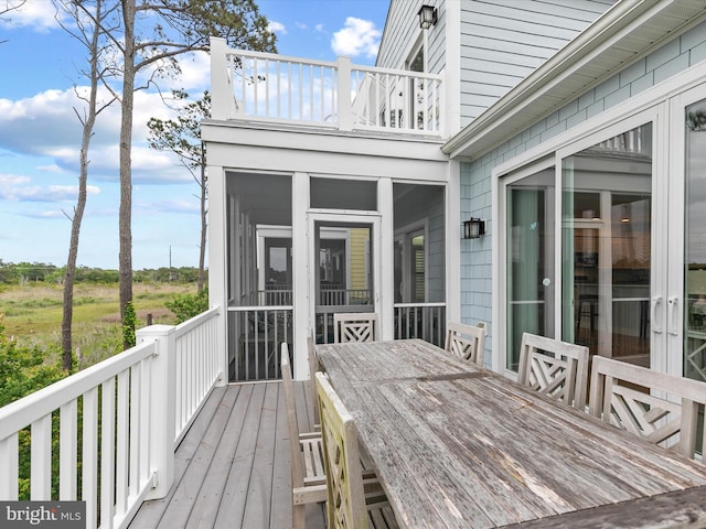 32561 Heron Cir Unit 13, Bethany Beach, DE 19930 - wooden deck with a sunroom and outdoor dining area