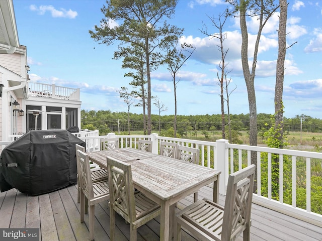 32561 Heron Cir Unit 13, Bethany Beach, DE 19930 - wooden terrace featuring outdoor dining area and a grill