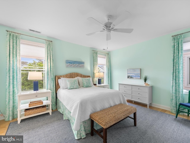 32561 Heron Cir Unit 13, Bethany Beach, DE 19930 - bedroom featuring wood finished floors, baseboards, and a ceiling fan