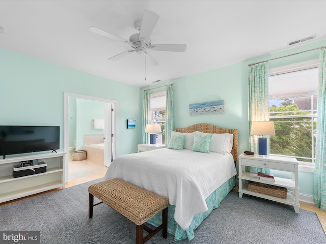32561 Heron Cir Unit 13, Bethany Beach, DE 19930 - bedroom featuring ensuite bathroom and ceiling fan