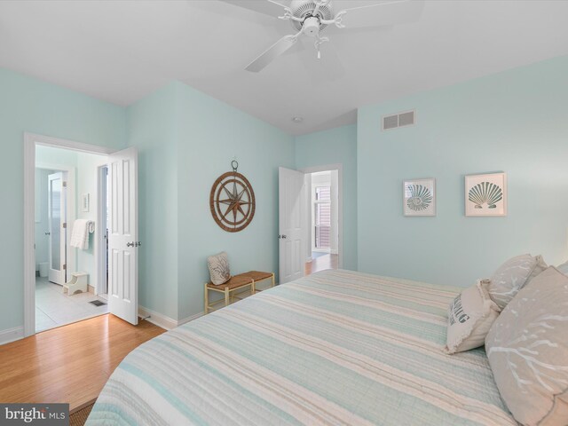 32561 Heron Cir Unit 13, Bethany Beach, DE 19930 - bedroom featuring wood finished floors, baseboards, and ceiling fan