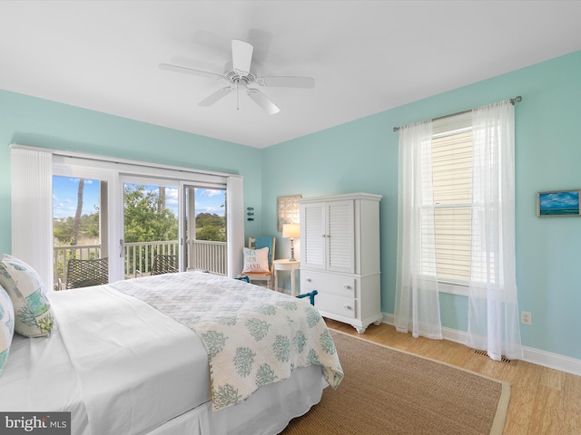 32561 Heron Cir Unit 13, Bethany Beach, DE 19930 - bedroom with access to exterior, wood finished floors, baseboards, and ceiling fan