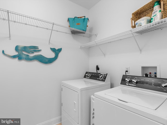 32561 Heron Cir Unit 13, Bethany Beach, DE 19930 - washroom featuring washer and clothes dryer and baseboards