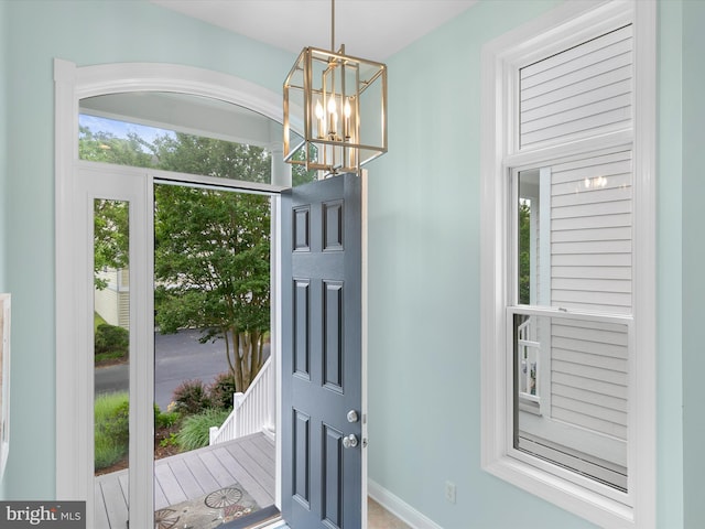 32561 Heron Cir Unit 13, Bethany Beach, DE 19930 - entrance foyer featuring a chandelier and baseboards