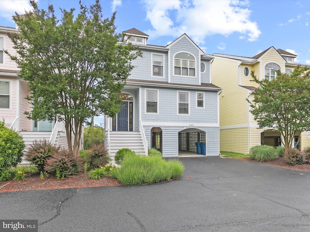 32561 Heron Cir Unit 13, Bethany Beach, DE 19930 - view of front of house featuring a carport and driveway
