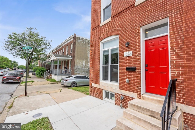 2328 Barclay St, Baltimore, MD 21218 - property entrance featuring brick siding