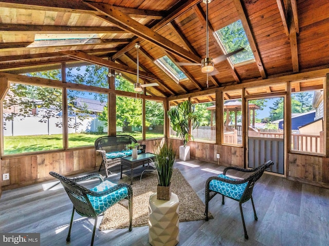 sunroom with a skylight and outdoor lounge area