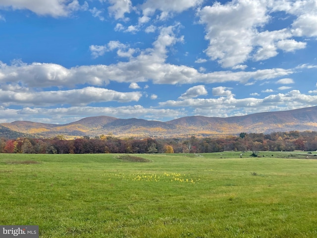 view of mountain backdrop featuring rural landscape