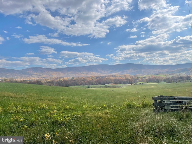 view of mountain backdrop featuring rural landscape