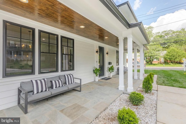 view of patio featuring a porch