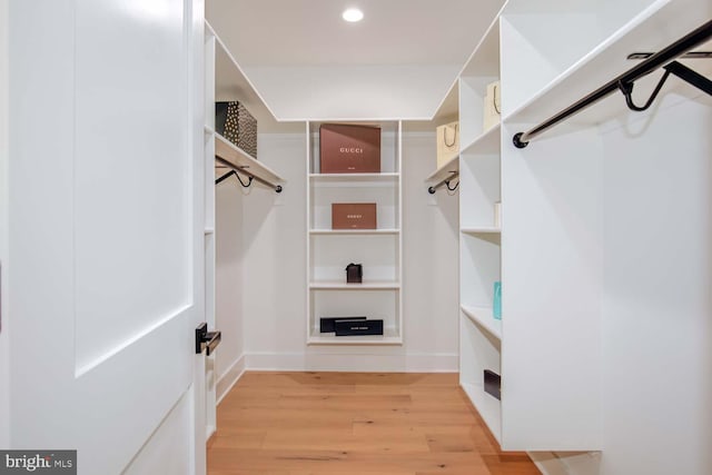 spacious closet with wood finished floors