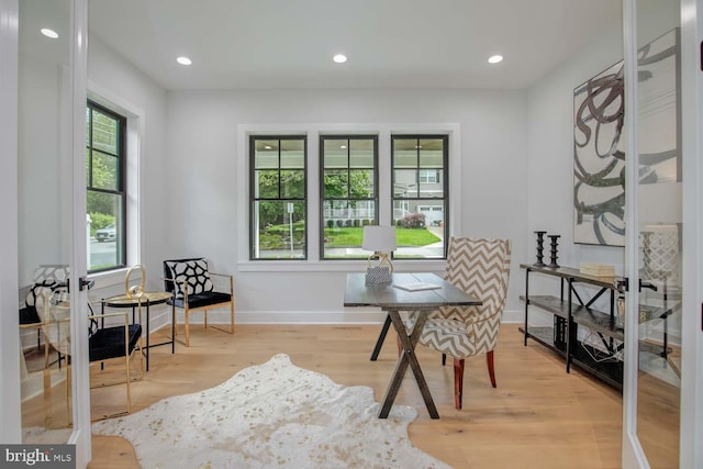 office area featuring plenty of natural light, light wood-style floors, baseboards, and recessed lighting