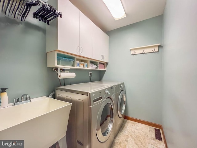500 Newport Cir, Langhorne, PA 19053 - washroom featuring cabinet space, independent washer and dryer, baseboards, and light stone finish flooring
