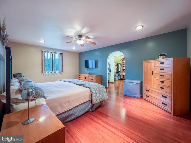500 Newport Cir, Langhorne, PA 19053 - bedroom featuring light wood finished floors, arched walkways, a spacious closet, recessed lighting, and a ceiling fan