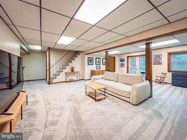 500 Newport Cir, Langhorne, PA 19053 - carpeted living area featuring a paneled ceiling, stairs, and baseboards