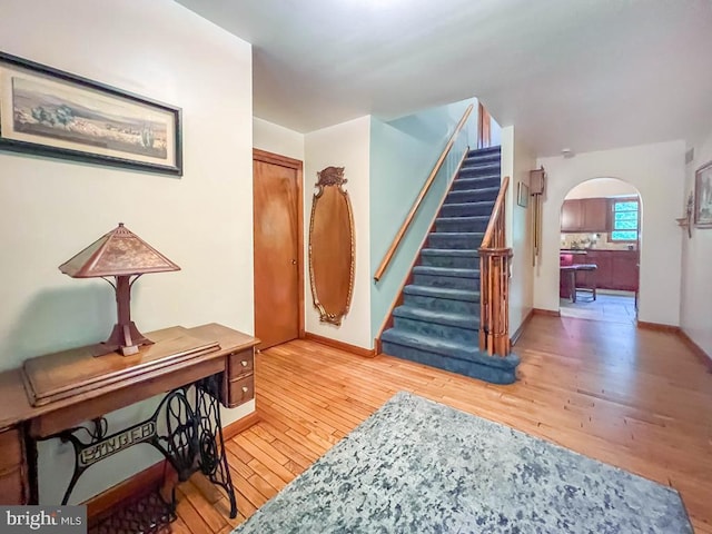 500 Newport Cir, Langhorne, PA 19053 - entrance foyer featuring arched walkways, light wood finished floors, stairs, and baseboards