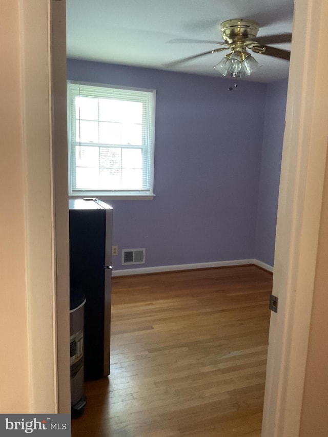 2817 Ontario Ave, Baltimore, MD 21234 - spare room with wood finished floors and ceiling fan
