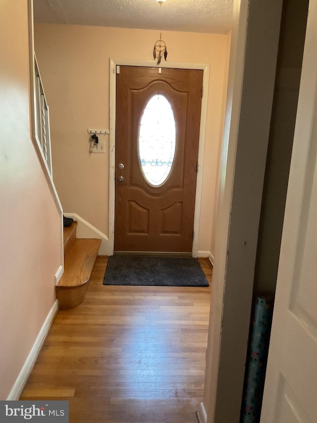 2817 Ontario Ave, Baltimore, MD 21234 - entryway featuring baseboards and wood finished floors