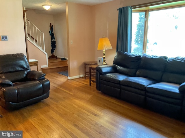 2817 Ontario Ave, Baltimore, MD 21234 - living room with light wood finished floors and stairs