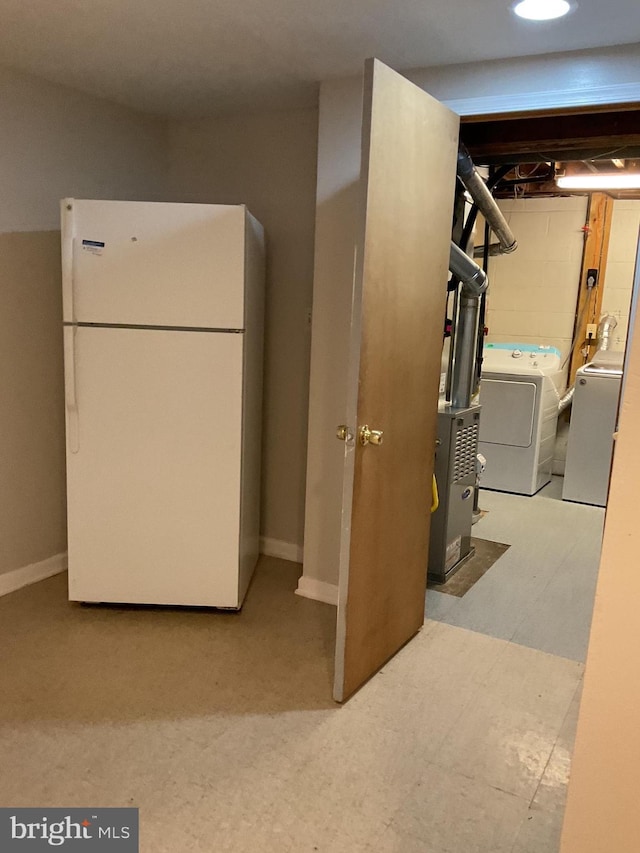 2817 Ontario Ave, Baltimore, MD 21234 - below grade area featuring freestanding refrigerator and washing machine and dryer