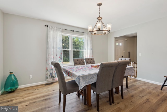 301 Heine Ave, Woodbine, NJ 08270 - dining room featuring a chandelier, hardwood / wood-style flooring, and baseboards