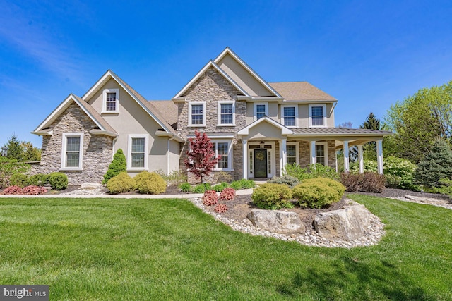 232 Cobblestone Ln, Bethlehem, PA 18020 - craftsman inspired home with stone siding, stucco siding, a front yard, and a porch