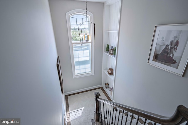 232 Cobblestone Ln, Bethlehem, PA 18020 - stairway featuring a chandelier, carpet flooring, and baseboards