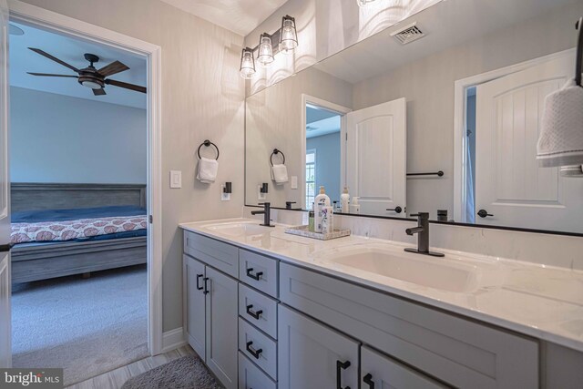 232 Cobblestone Ln, Bethlehem, PA 18020 - full bath featuring ceiling fan, double vanity, connected bathroom, and baseboards
