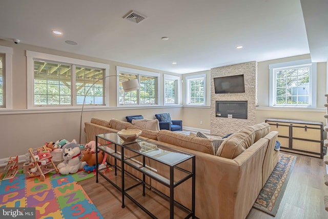 232 Cobblestone Ln, Bethlehem, PA 18020 - living room with plenty of natural light, wood finished floors, a stone fireplace, and recessed lighting