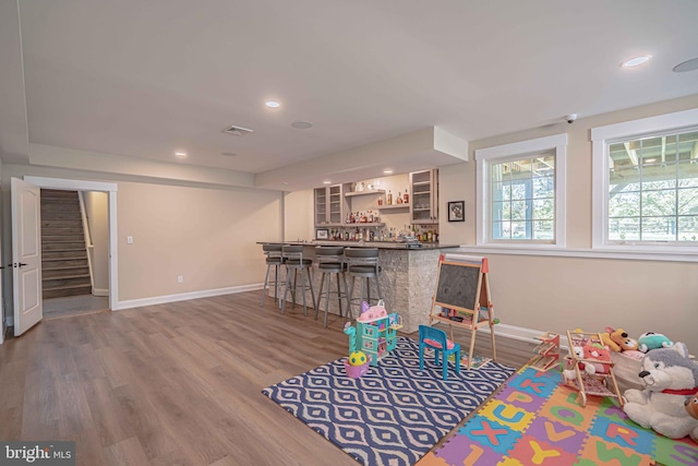 232 Cobblestone Ln, Bethlehem, PA 18020 - game room featuring a bar, baseboards, wood finished floors, and recessed lighting