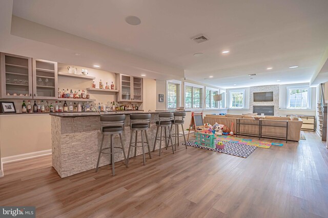 232 Cobblestone Ln, Bethlehem, PA 18020 - indoor bar with light wood-type flooring, recessed lighting, and a large fireplace