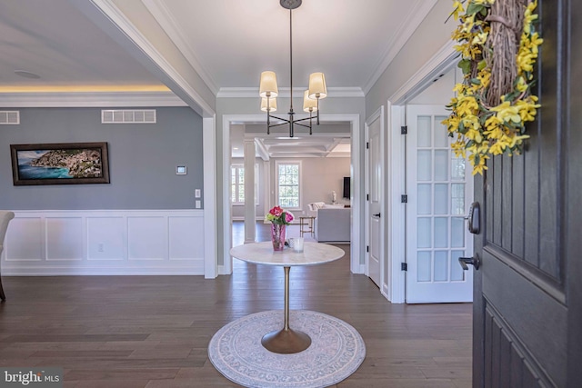 232 Cobblestone Ln, Bethlehem, PA 18020 - foyer featuring ornamental molding, dark wood-style floors, a chandelier, a wainscoted wall, and a decorative wall