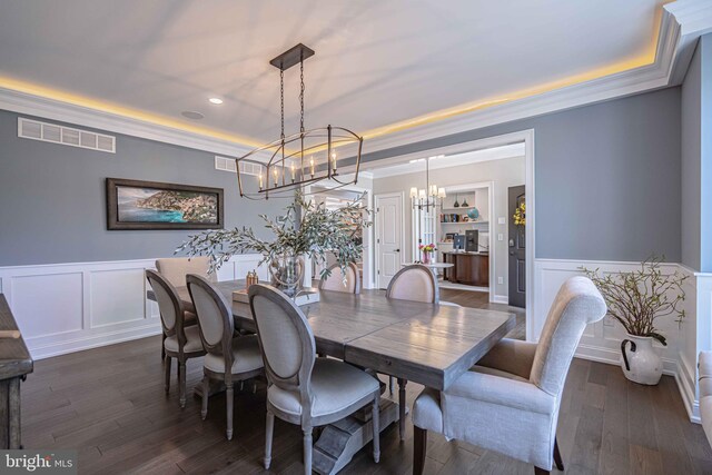 232 Cobblestone Ln, Bethlehem, PA 18020 - dining area with a tray ceiling, a chandelier, a decorative wall, wainscoting, and recessed lighting