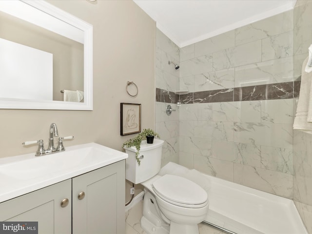 full bath featuring toilet, tiled shower, and vanity