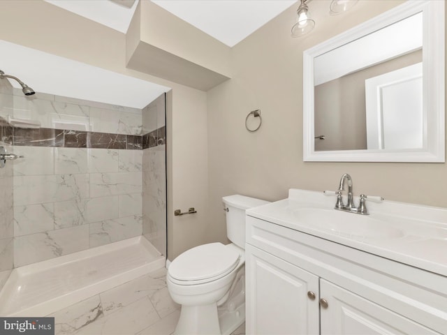 full bath with marble finish floors, toilet, a shower stall, and vanity