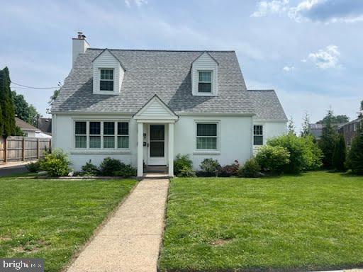 1381 Burmont Rd, Drexel Hill, PA 19026 - cape cod house featuring stucco siding, a chimney, and a shingled roof