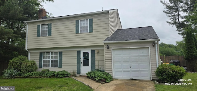 9809 Ambler Ln, Upper Marlboro, MD 20774 - colonial house with a chimney, a garage, a shingled roof, concrete driveway, and fence
