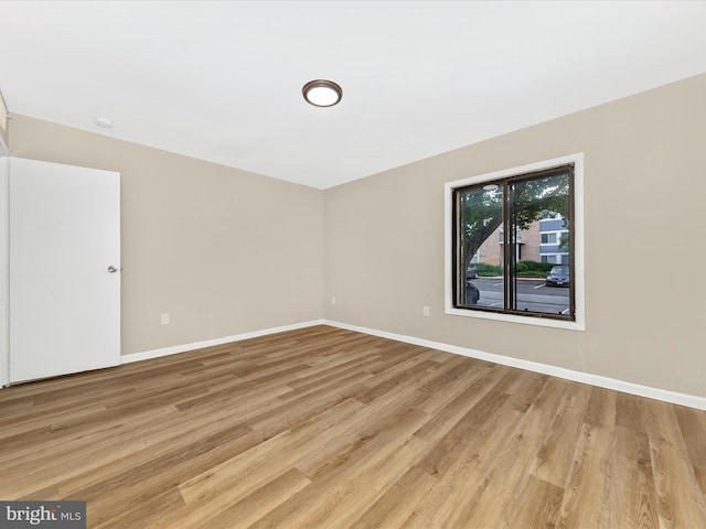 6994 Hanover Pkwy Unit 101, Greenbelt, MD 20770 - spare room featuring light wood-style flooring and baseboards