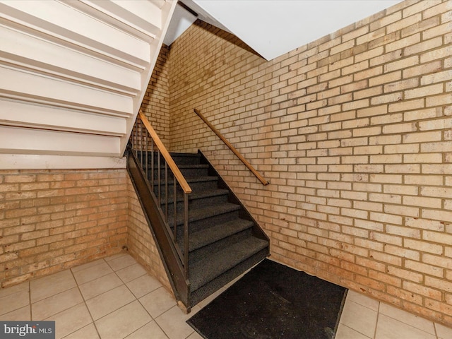 6994 Hanover Pkwy Unit 101, Greenbelt, MD 20770 - stairway with brick wall and tile patterned flooring