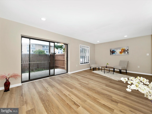 6994 Hanover Pkwy Unit 101, Greenbelt, MD 20770 - empty room featuring wood finished floors, baseboards, plenty of natural light, and recessed lighting