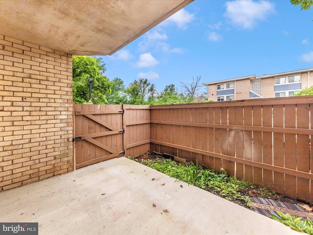 6994 Hanover Pkwy Unit 101, Greenbelt, MD 20770 - view of patio / terrace with a gate and fence
