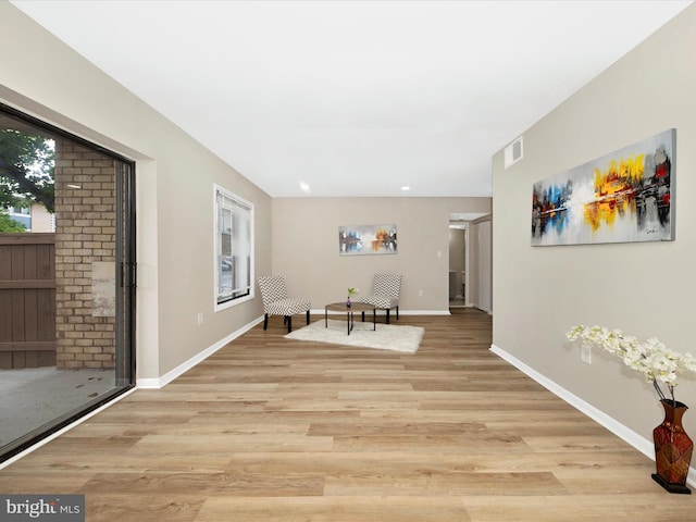 6994 Hanover Pkwy Unit 101, Greenbelt, MD 20770 - living area featuring light wood-style flooring and baseboards