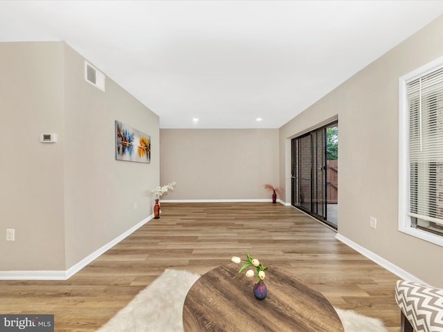 6994 Hanover Pkwy Unit 101, Greenbelt, MD 20770 - unfurnished living room featuring light wood-style floors, baseboards, and recessed lighting