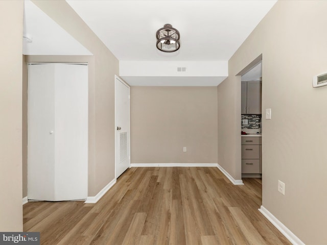 6994 Hanover Pkwy Unit 101, Greenbelt, MD 20770 - hall with light wood-style flooring and baseboards