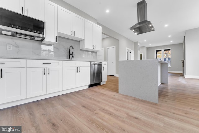 kitchen featuring appliances with stainless steel finishes, island exhaust hood, light wood-style floors, white cabinetry, and recessed lighting