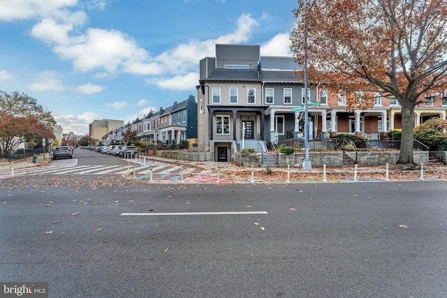 view of front of property with a residential view and a porch