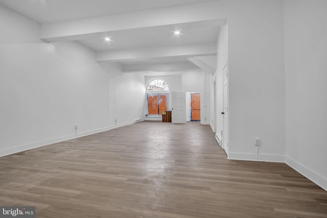 19 Valley St, Lewistown, PA 17044 - empty room with wood finished floors, baseboards, recessed lighting, and lofted ceiling