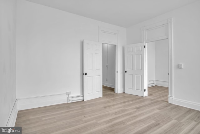 19 Valley St, Lewistown, PA 17044 - unfurnished bedroom with light wood finished floors, a baseboard heating unit, and baseboards