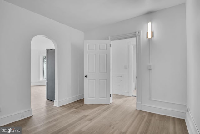 19 Valley St, Lewistown, PA 17044 - unfurnished room with arched walkways, wood finished floors, and baseboards