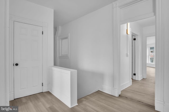19 Valley St, Lewistown, PA 17044 - corridor with light wood finished floors, baseboards, and an upstairs landing